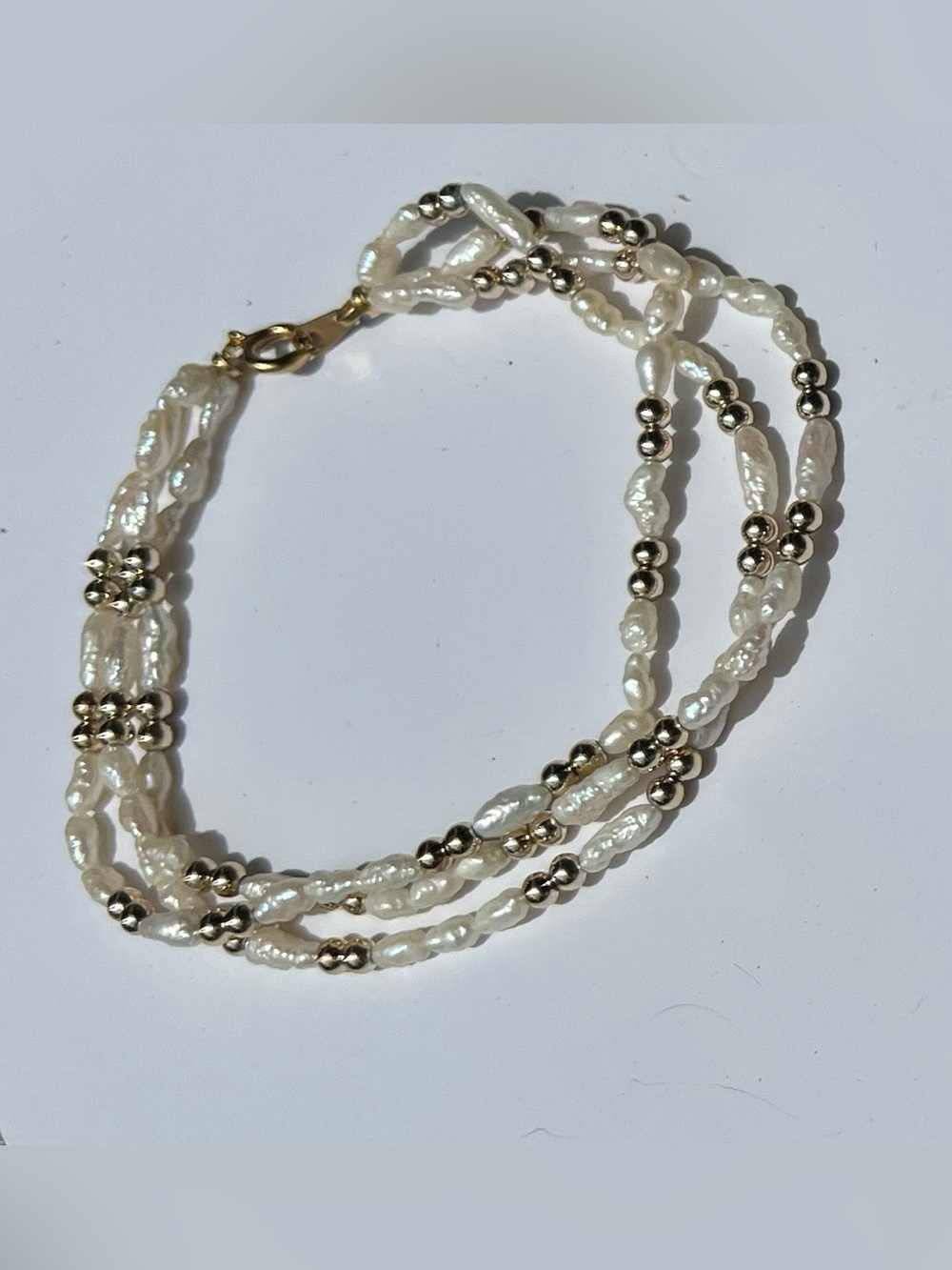 Triple-Strand Freshwater Pearl Bracelet with Gold Beads - White